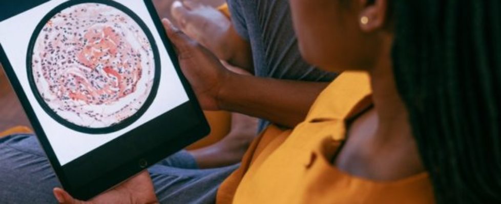 person-in-yellow-shirt-holding-black-tablet-computer-3621151